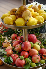 apples and lemons on plates. Autumn harvest.