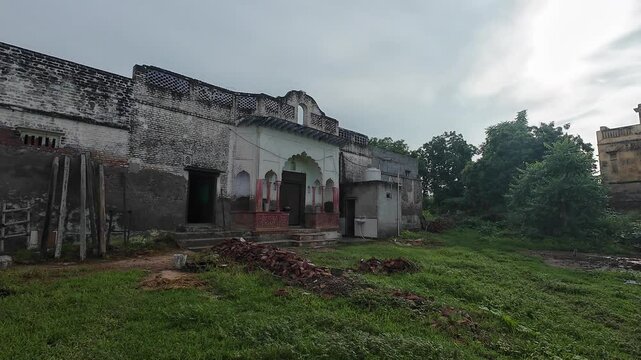 Exterior view of a haweli nestled in a serene rural landscape, harmonizing with the surrounding natural environment