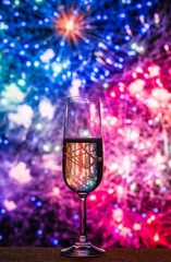 Sparkling Champagne Glass In Front Of A Vibrant Fireworks Show, A Symbol Of Luxury And Celebration For Important Occasions Like New Year's Eve, Weddings, And Special Events. Year-End Background 