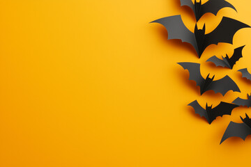 Halloween background with  paper bats on an yellow  surface, flat lay top view with space for text.Flat lay.Minimal creative holiday concept 
