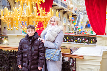 mom and son take a walk on christmas holidays