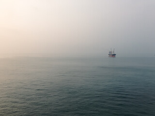 Lone boat in serene seascape. Solitude at Sea