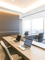 Naklejka premium Modern office workspace with laptops and a view of the city skyline.