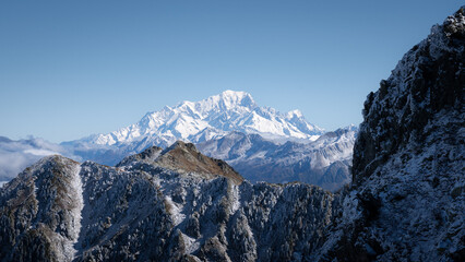 sunning panoramic view of the Mont Blanc in autumn. Snowy mountains in autumn in the french alps. beautiful colors, blue sky, sea of clouds