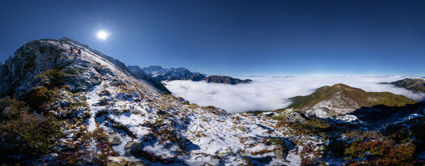 stunning sea of clouds in the french alps panorama. Autumn mood, sunny day, blue sky