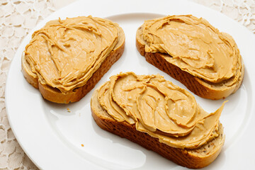 A plate of pasta with toast and whites. Food meal healthy concept. A plate of toasts with nut butter and a slice of bread. A plate of toasts, bread, and lifestyle nut butter.