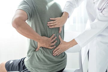 Male patients consulted physiotherapists with Low back pain for examination and treatment. Rehabilitation physiotherapy concept.