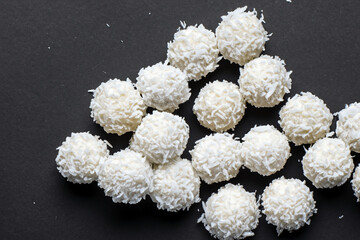 White and with candies. candy food sweet concept. a round round candies on a with raffaello. a round raffaello on a with white candies lifestyle.