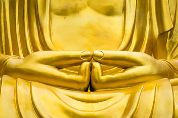 Samut Sakhon, Thailand - September, 25, 2024 : Golden Buddha Statue in Serene Cave in Lak Si Temple...