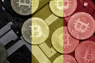 flag of belgium on the bitcoins with computer electronic circuit board background. bitcoin concept