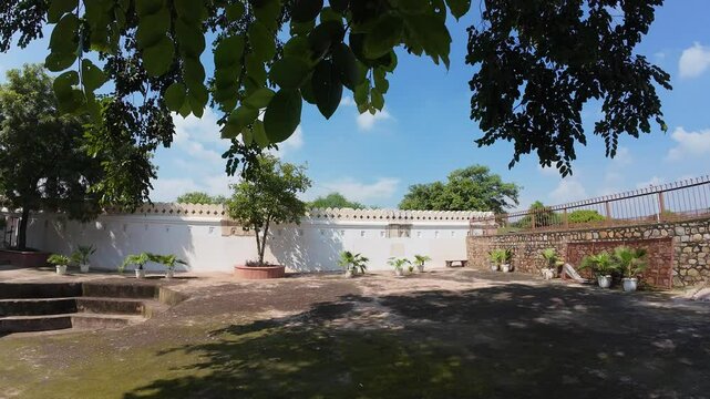 Courtyard of Jamali Kamali tomb and mosque at Mehrauli Delhi , India