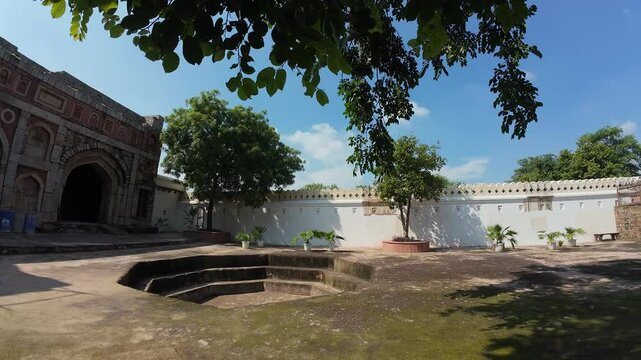 Courtyard of Jamali Kamali tomb and mosque at Mehrauli Delhi , India
