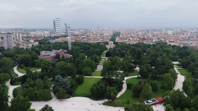 Milan city Simplon Gate and arch of peace famous landmark with modern cityscape in background drone aerial footage