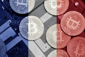 flag of france on the bitcoins with computer electronic circuit board background. bitcoin concept