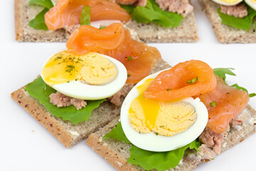 Breakfast of eggs, fish, and sandwiches. egg meal food concept. diet of fish, eggs, and cheese on white . a breakfast of eggs, fish, and a salad with a diet on a lifestyle white.