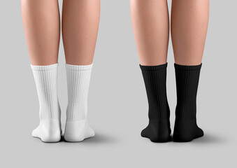 Mockup of black, white long socks with elastic band on slim female legs, back view, isolated on...