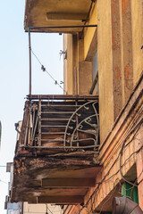 Collapsing cracked balcony. Buildings in need of repair concept