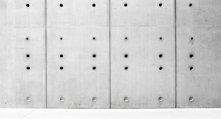 Abstract concrete wall background with spotlight effect, featuring textured surface with evenly...