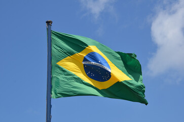 Flag of Brazil fluttering in the wind. In the center of the flag with the words "order and progress" in Portuguese. flag day. proclamation of the Republic. proclamação da república