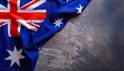 Happy Australia day. Australian flag against old grey stone background. 26 January. Australia day concept. Copy space.