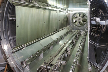 Drying conveyor line. Industrial exhaust fan. Food engineering. Production line inside steel...