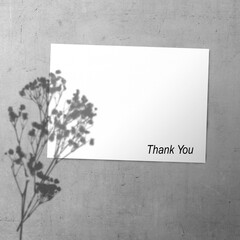 White paper with flowers shadow and words 