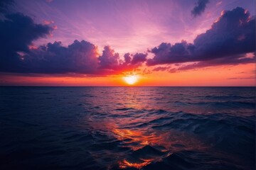 Obraz premium Vibrant Sunset Over Ocean with Dramatic Clouds