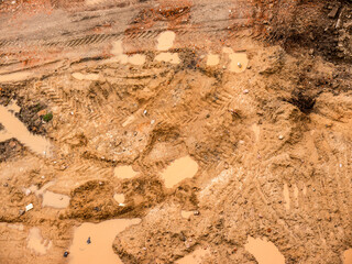 Rain. Construction. Puddles. Mud. View from above.