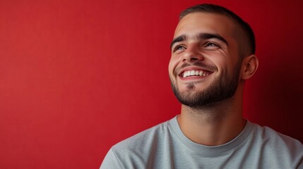 Obraz premium Portrait of a happy handsome man in a shirt with laughing