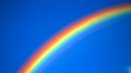 Fototapeta premium A rainbow arching across the sky, with white clouds in front of it