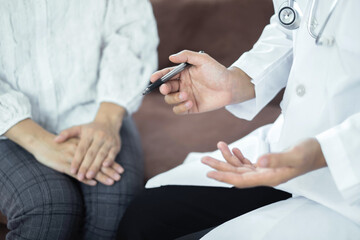 Female doctors who treat patients make an appointment to listen to the results after a physical...
