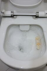 A Clean White Toilet Bowl With Fresh Water Swirling During A Flush, Capturing Cleanliness And Hygiene. Ideal For Concepts Related To Sanitation And Bathroom Maintenance.