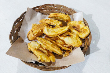 Fried Bananas on a Rattan Plate on the table