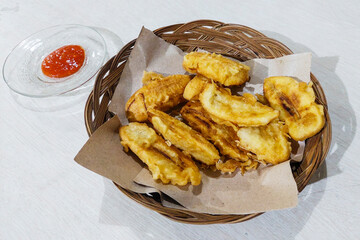 Fried Bananas on a Rattan Plate on the table