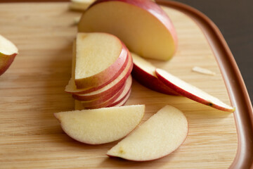 Slices of Apple on Wooden Cutting Board - Close-Up