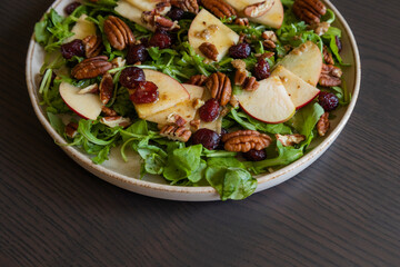Fall Salad with Arugula, Apples, Cranberries, and Pecans - Close-Up