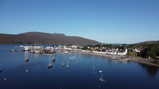 Revealing drone shot of the docks at Ullapool, Scotland