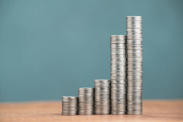 Step stairs of money coins take a leap growth more than usual in the last period, busniess progress, long term savings, compound interest