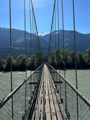 Obraz premium bridge over the river alps mountains