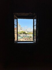 window in the house leading to the summer street of rome