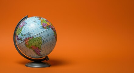 Globe on orange background depicting world geography