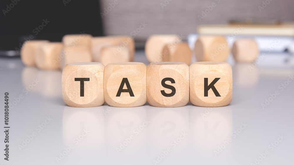 Poster engaging wooden blocks spelling task displayed on an aesthetic minimalist desk setting