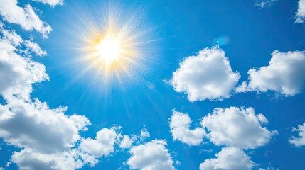 A bright blue sky with soft, white clouds illuminated by the shining sun, creating a serene and uplifting atmosphere.