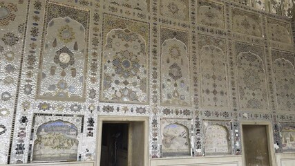 Intricate mirror work and detailed marble inlay inside the Sheesh Mahal at Lahore Fort, a stunning example of Mughal craftsmanship