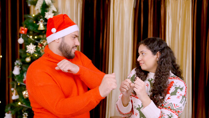Indian Couple Dancing with Christmas Tree in background