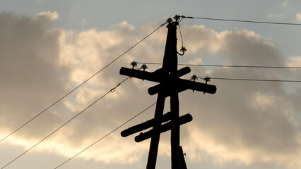 Old power lines at sunset