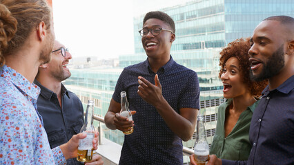 Multi-Cultural Business Team Meeting Outdoors For After Work Drinks On Office Rooftop Or Bar