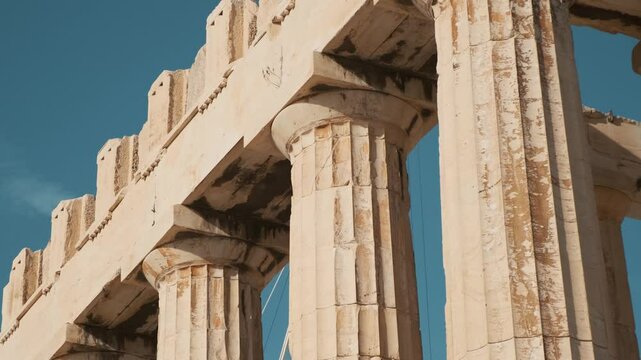 Close up of columns of Parthenon temple on the Acropolis in Athens, Greece. Ancient Greek architecture. Popular travel and touristic landmark