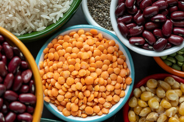 several pots with raw grains for preparing healthy food