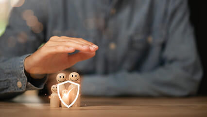 Male hand Represents protection and protection of family safety, Insurance management...